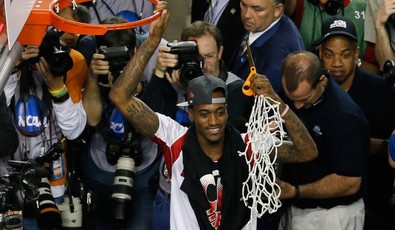 Injured-louisville-guard-kevin-ware-celebrates-after-cutting-down-the-net-after-his-team-beat